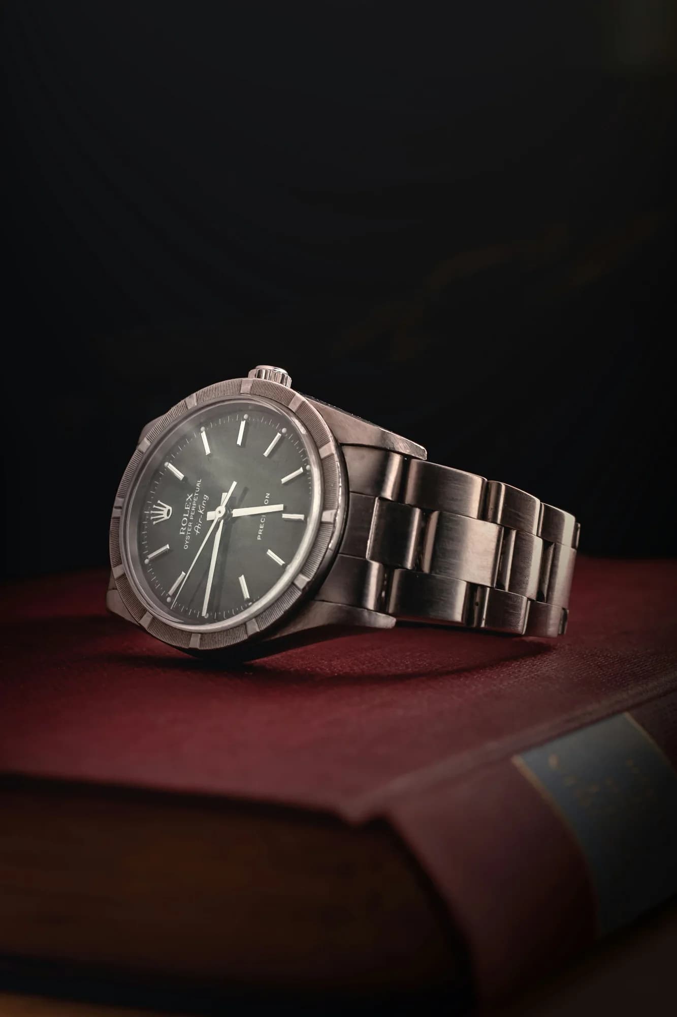 Stainless steel automatic watch with a dark dial