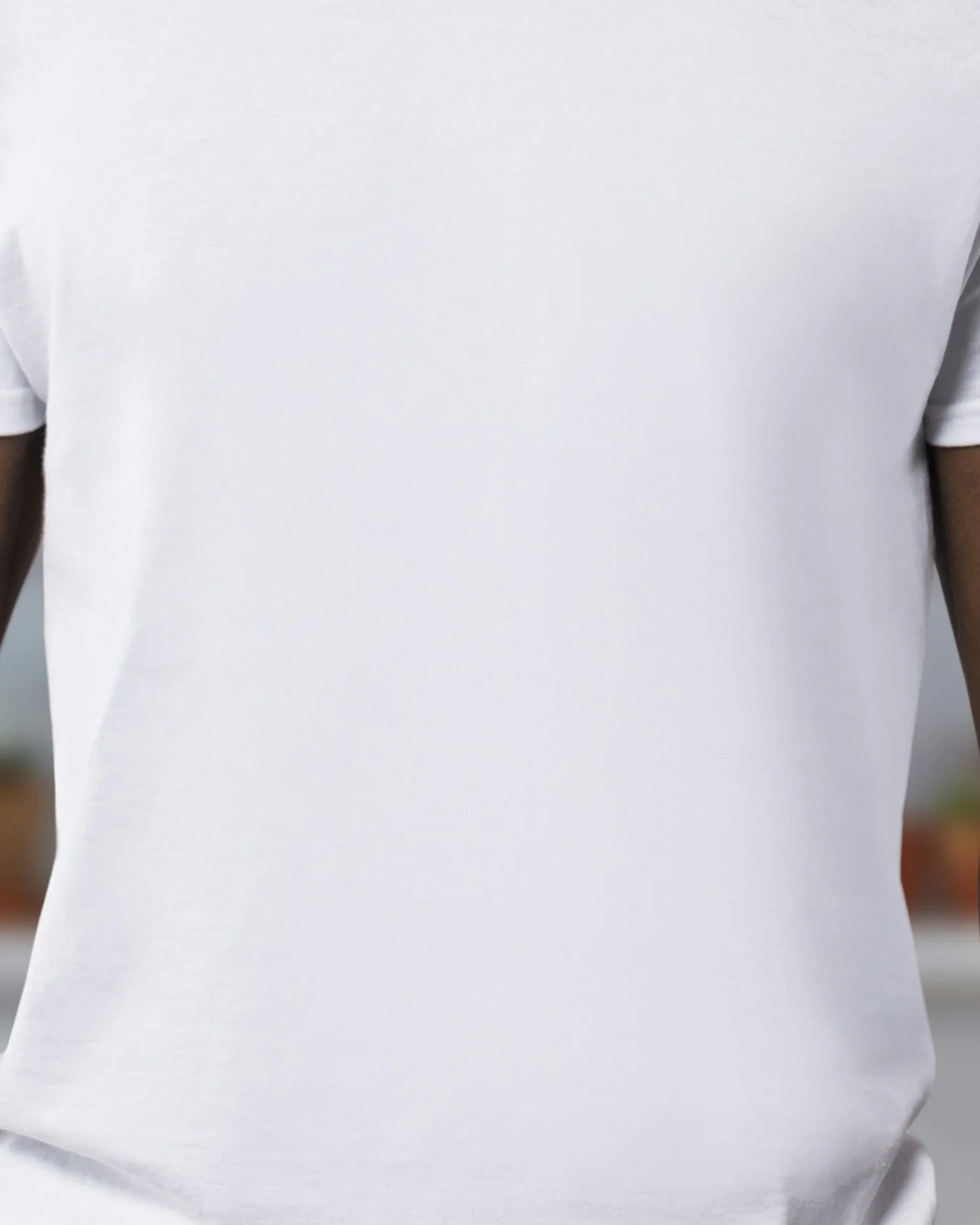 Man wearing a plain white heavyweight t-shirt — detail