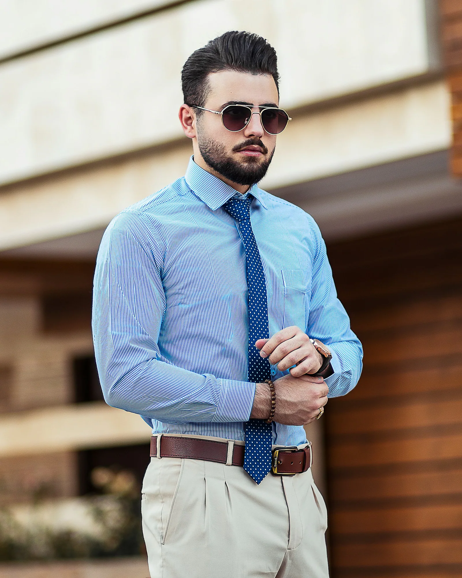 Man wearing a light blue dress shirt and tie
