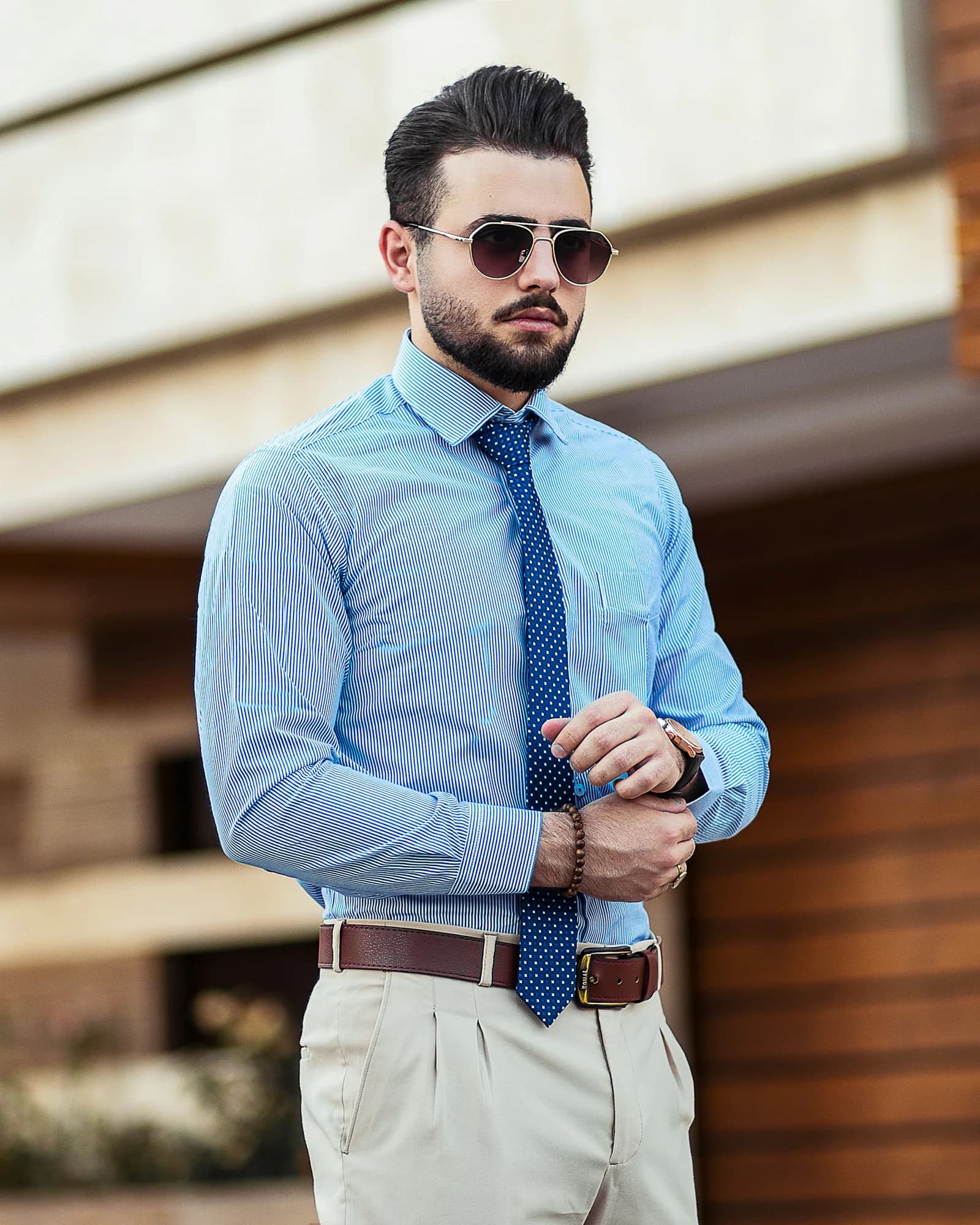 Man wearing a light blue dress shirt and tie